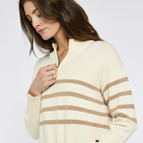 Woman demonstrates zip detail on Dubarry Ladies Fonthill Quarter Zip Sweater in Oyster