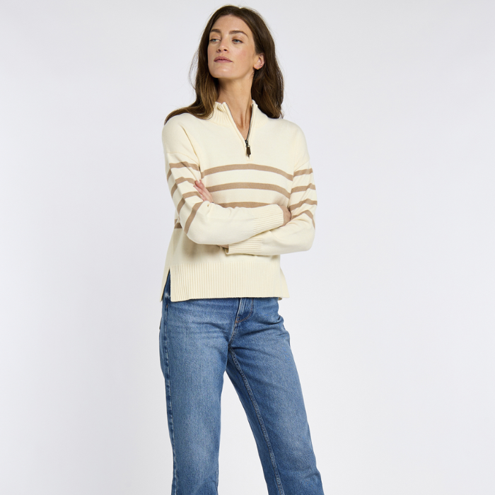 Woman wears the Dubarry Ladies Fonthill Quarter Zip Sweater in Oyster with blue jeans