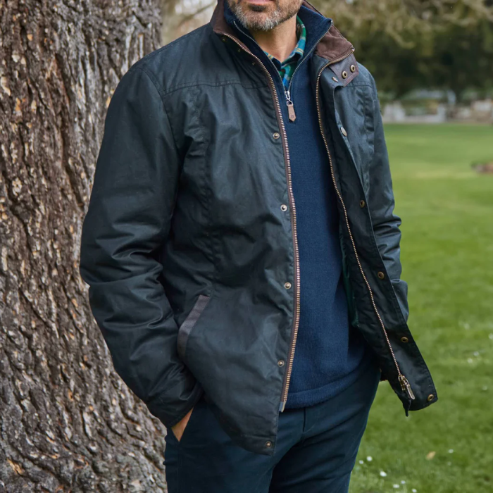 Man Stand By Tree Wearing Dubarry Mens Carrickfergus Waxed Jacket in Black | Eland Lodge