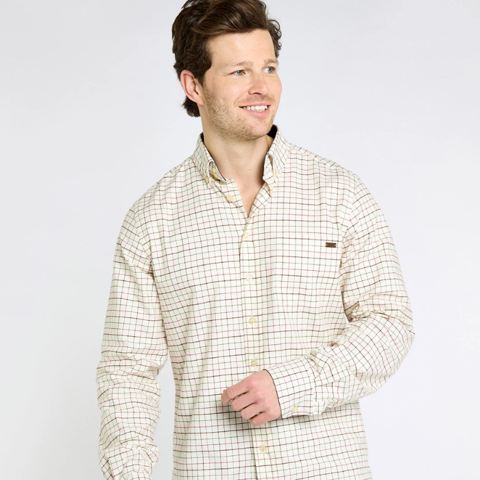 Man wearing a beige checkered shirt on a white background