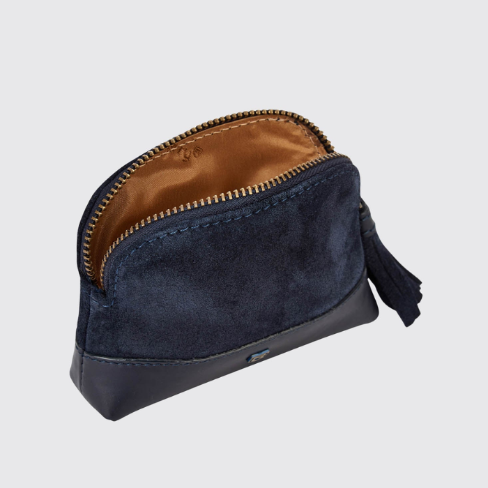 Navy blue coin purse with gold interior on a light grey background