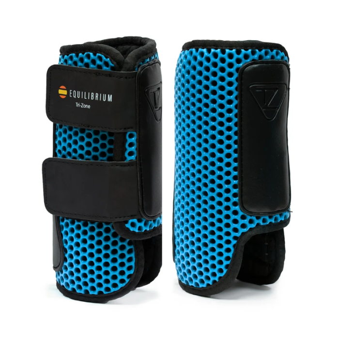 Pair of blue horse leg protective boots with Equilibrium branding on a white background