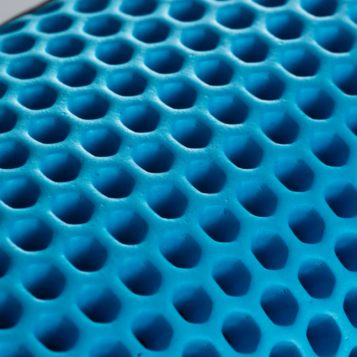 Close-up of blue foam with a honeycomb pattern