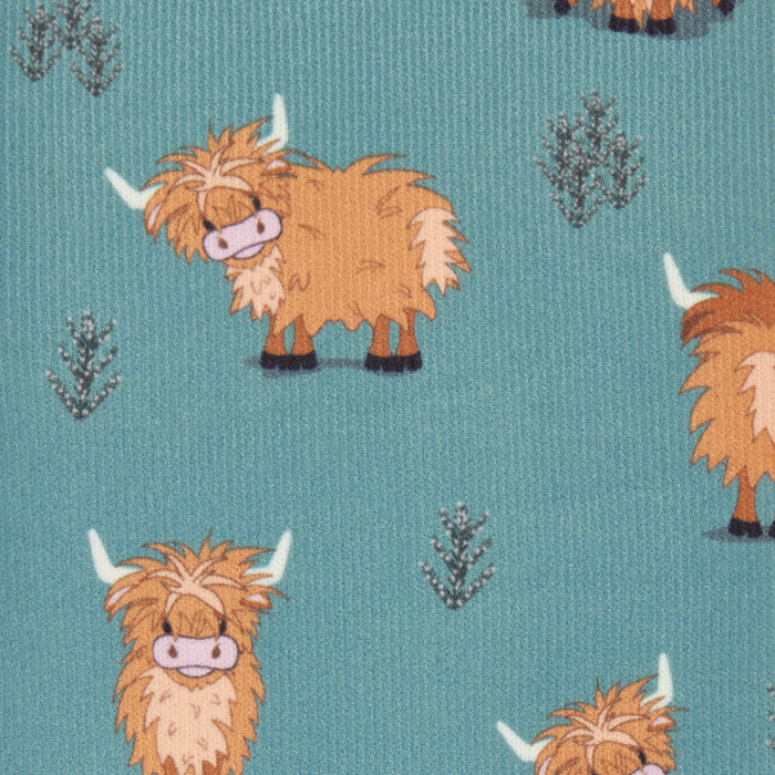 LeMieux AW26 Footsie Socks Highland Cow Variant Colour Aloe.
A close-up of fabric featuring a repeating pattern of fluffy Highland cows and small gray plants on a teal blue background.