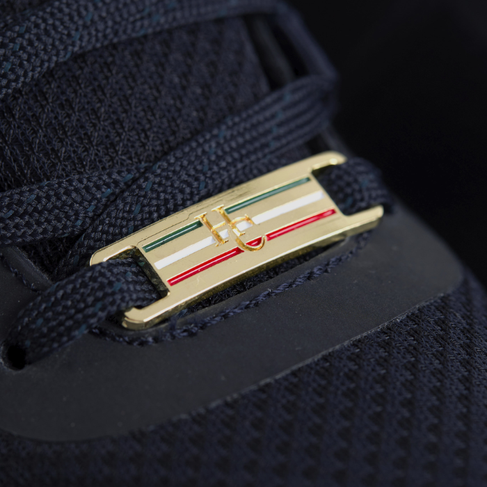 Branding detail on the Holland Cooper Burghley Waterproof Trainer in Ink Navy