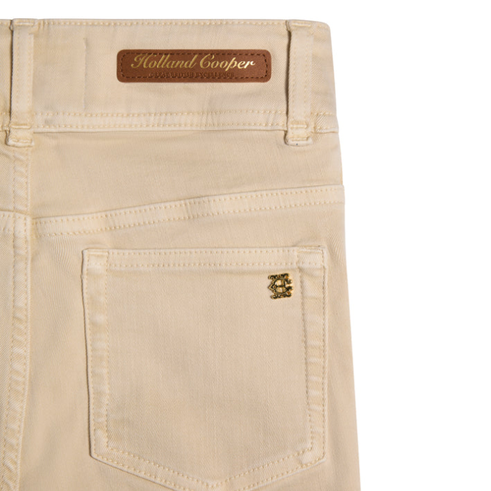 Beige jeans with Holland Cooper branding on a white background