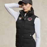 Woman wears the Holland Cooper Team HC Gilet in Black with baseball cap