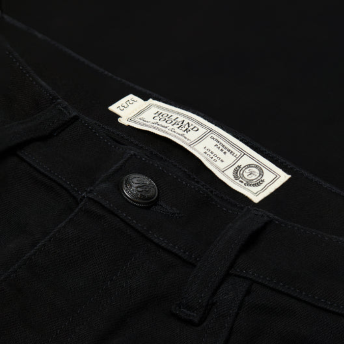 Close-up of a black garment with a Holland Cooper label.