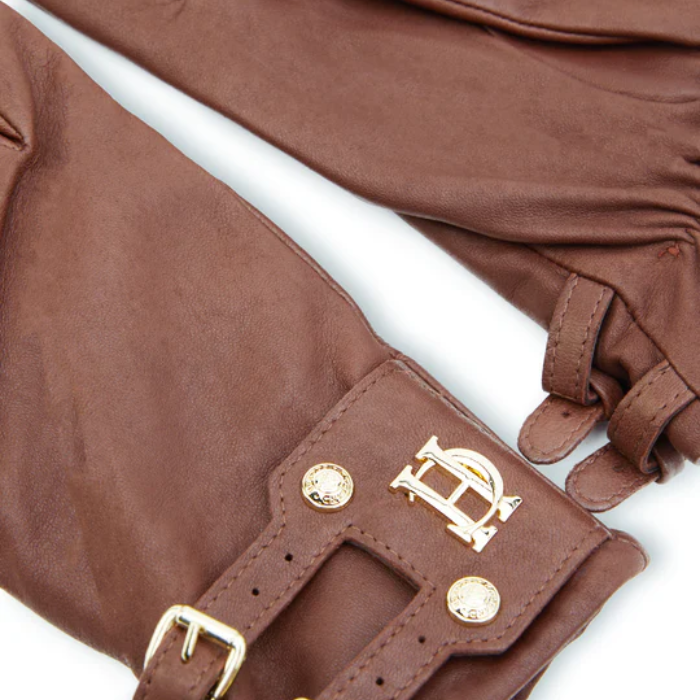 Brown leather glove with gold buckle and logo on a white background