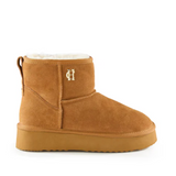 Tan suede boot with white fur lining on a white background