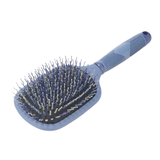 Blue pet grooming brush on a white background