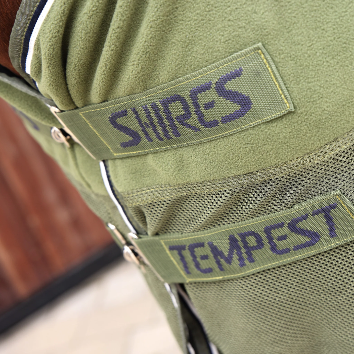 Close up of horse wearing green blanket showing front fastners 'Shires'