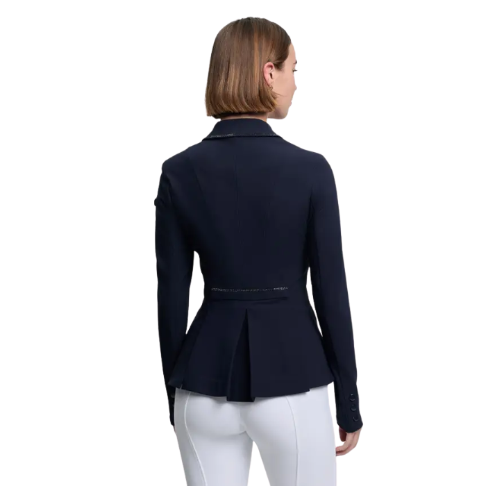Woman wearing a navy blue jacket on a white background