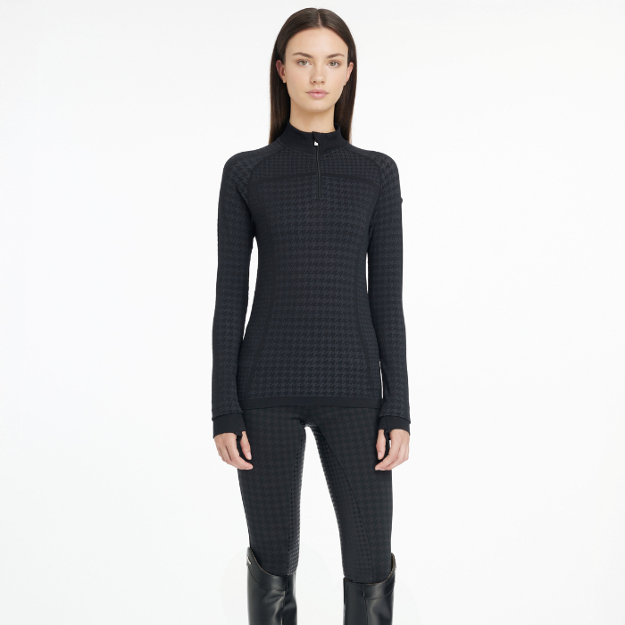 Person wearing a black checkered outfit on a white background