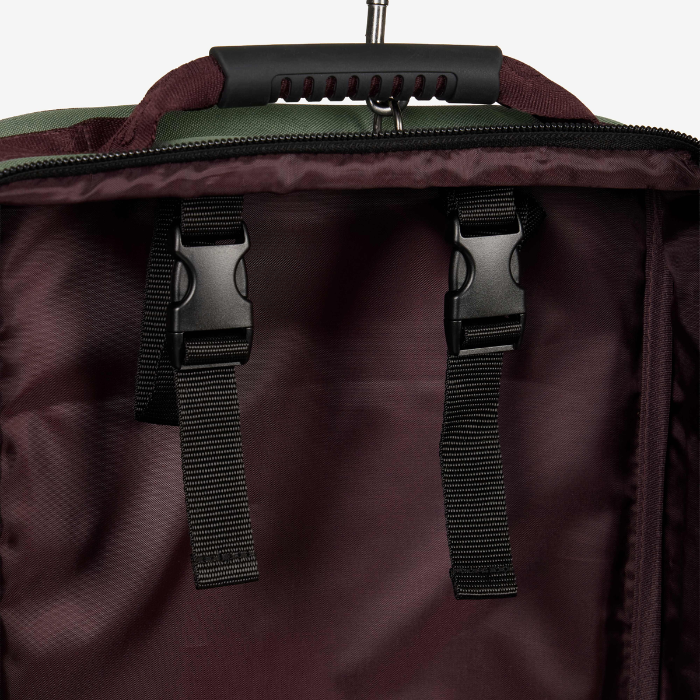 Close-up of a dark case with black straps and handle on a white background