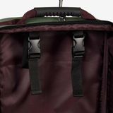 Close-up of a dark case with black straps and handle on a white background