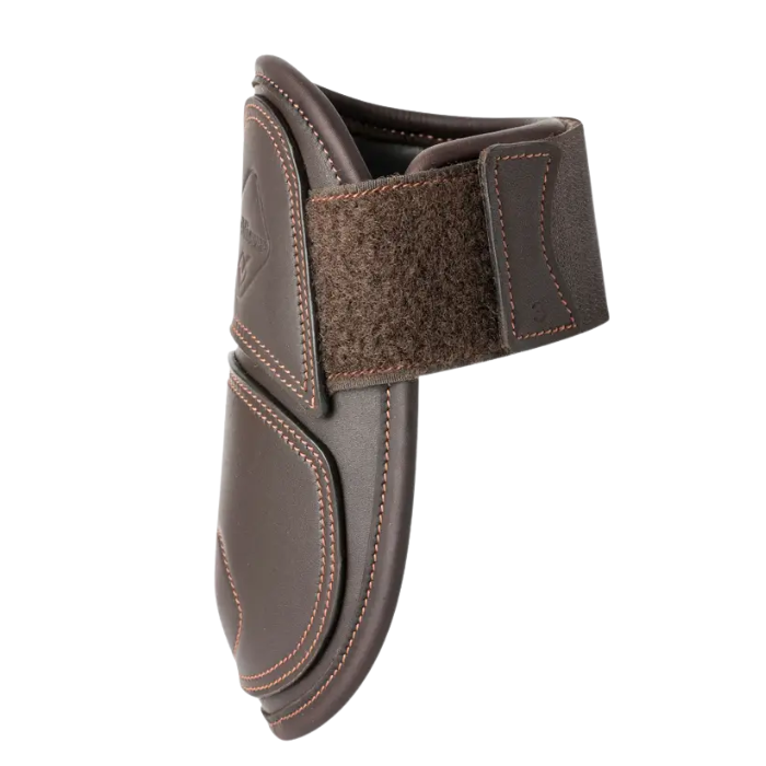 Brown leather boot with a velcro strap on a white background