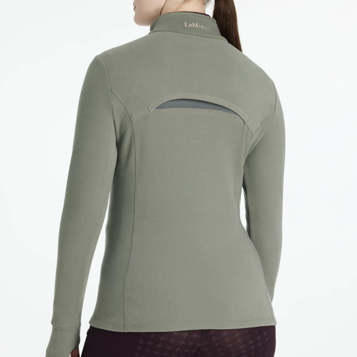 Green long-sleeve riding top with a brand logo on a white background