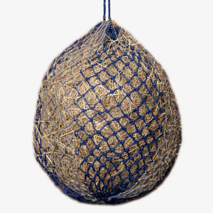 Net full of hay made with a blue mesh on a white background