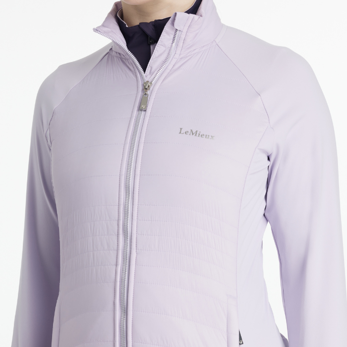 Light purple jacket with a zipper on a white background, featuring the brand 'LeMieux'.