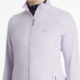 Light purple jacket with a zipper on a white background, featuring the brand 'LeMieux'.