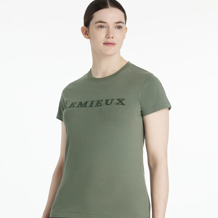 Person wearing a green t-shirt with 'LEMIEUX' text on a white background