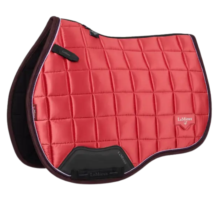 Cranberry red quilted saddle pad with black accents on a white background