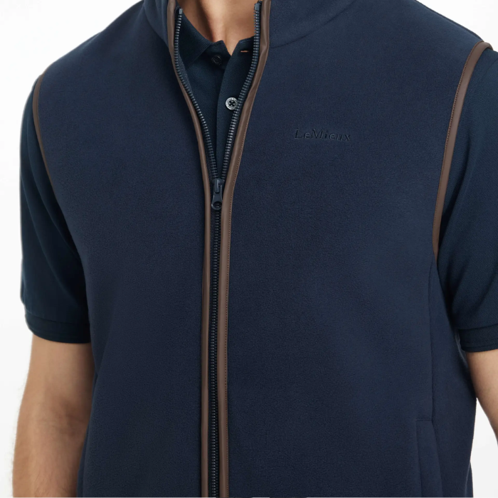 Navy blue short-sleeve gilet with brown zipper on a white background