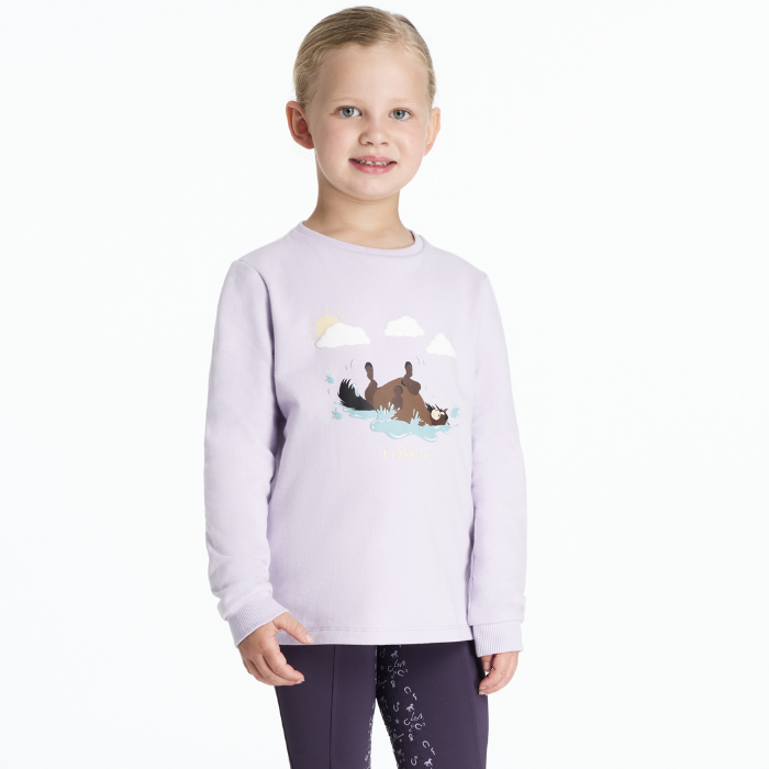 Child wearing a light purple sweatshirt with a graphic horse design on a white background