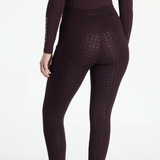 Dark purple riding leggings with a textured pattern on a white background
