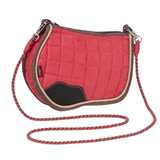 Red quilted saddlebag with brown trim and a long strap on a white background