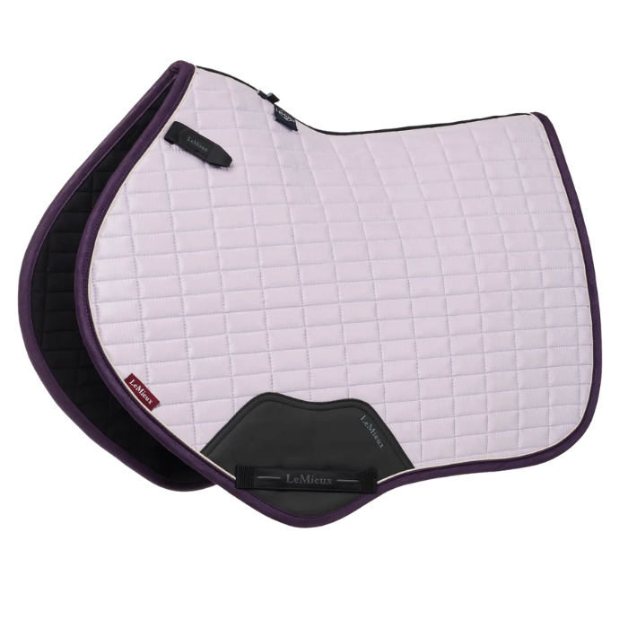 Lilac quilted saddle pad with purple border and LeMieux logo on a white background
