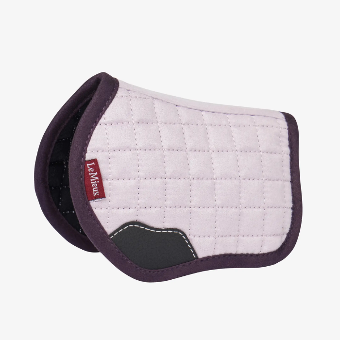 White quilted horse saddle pad with purple border on a white background