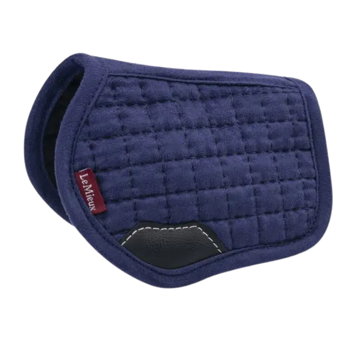 Blue quilted saddle pad with a visible brand logo on a white background