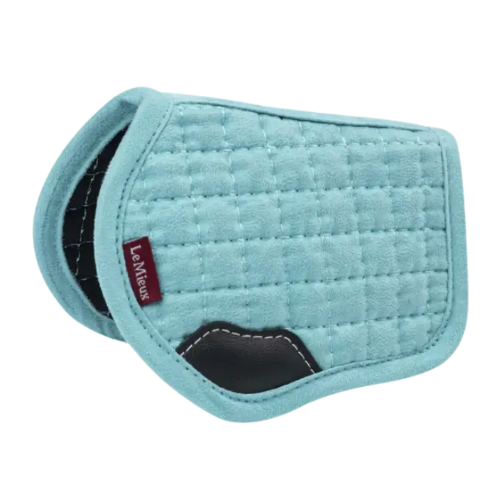 Teal quilted saddle pad with 'Le Mieux' branding on a white background