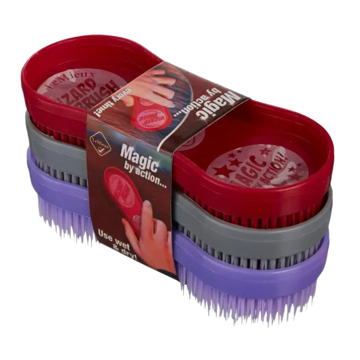 Set of three horse grooming brushes in red, grey, and purple with packaging on a white background.