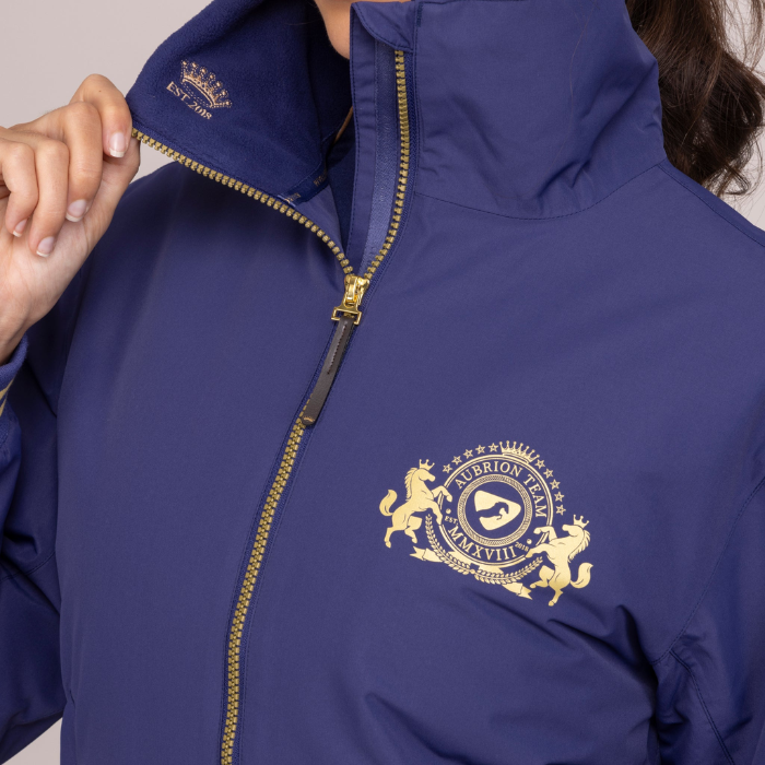 Close up logo detail of the Shires Aubrion Team Blouson in Midnight