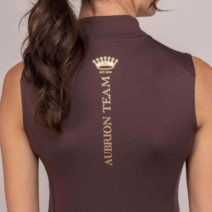 Logo detail on the reverse of the Shires Aubrion Team Sleeveless Base Layer in Umber