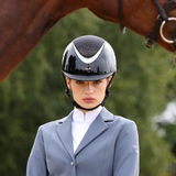 Horse riding wearing the Shires Karben Ariel Ellipse SP Riding Hat 