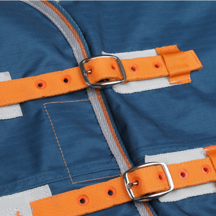 Close-up of a blue jacket with orange straps and buckles