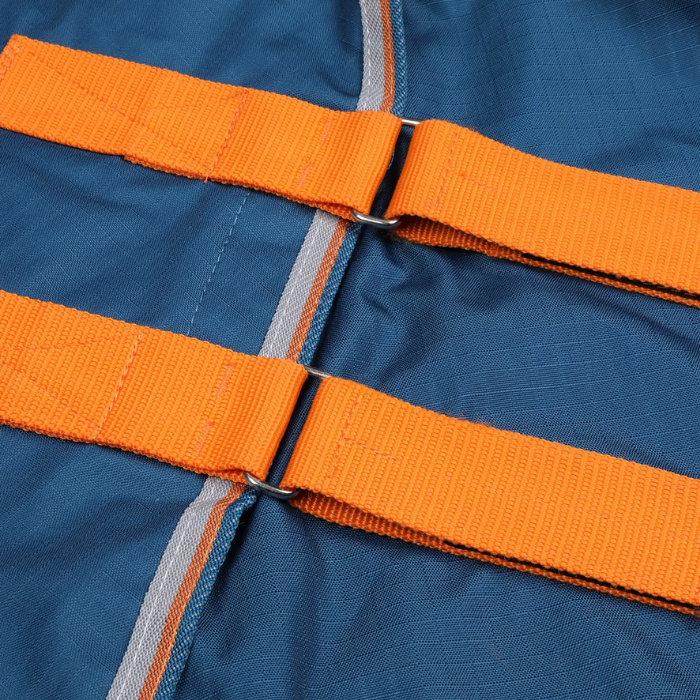 Close up of orange straps on a blue rug