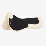 Horse half saddle pad black and natural fur trim on white background
