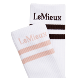 LeMieux AW26 Tall Crew Socks 2 Pack Variant Colour White.
Two white LeMieux crew socks, one with dark brown stripes and logo, and the other with light pink stripes and logo, shown on a white background.