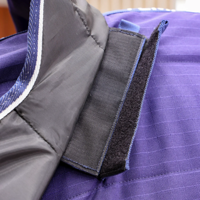 Velcro attachment on navy horse rug