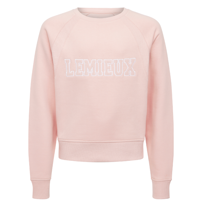 LeMieux AW26 Young Rider Shay Varsity Crew Varient Petal. A light pink crewneck sweatshirt with 'LEMIEUX' printed across the chest in white outlined block letters, displayed on a clean white background.