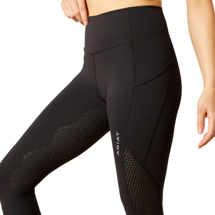 Black athletic leggings with mesh panels on a white background