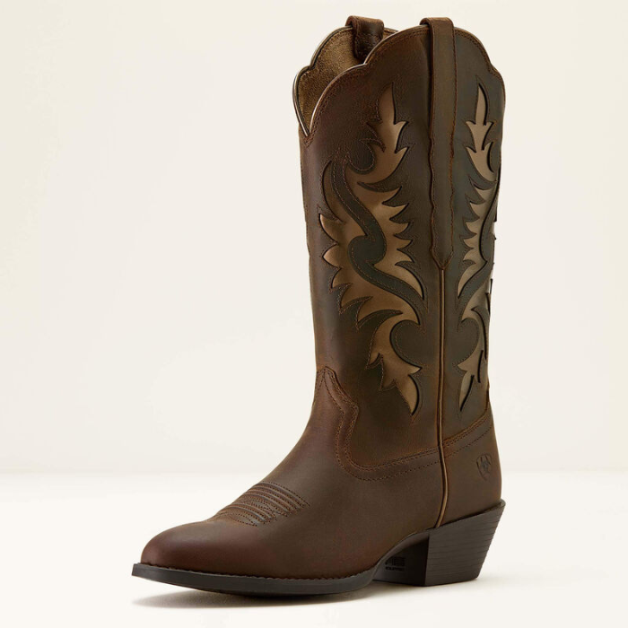 Ariat Ladies Heritage R Toe Western Boot Variant Colour Sassy Brown. Western boot with decorative stitching and gold coloured material with R shaped toe on light cream background. 