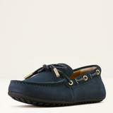Navy blue loafer shoe on a light beige background