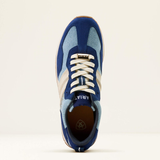 Blue and white trainers with 'Ariat' branding on a light beige background