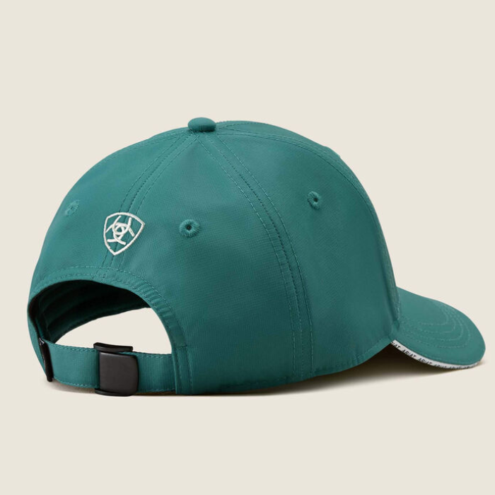 Green baseball cap with brand logo on a beige background